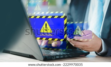 Businessman or it staff , programmer, developer using computer laptop with triangle caution warning sign for notification error and maintenance concept..
