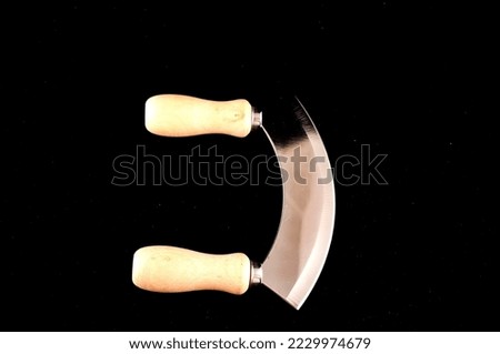 Photo Picture of a Kitchen Curved Metallic Knife Tool