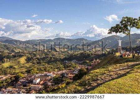 Wide panorama of the superb village (pueblo) of Jerico, antioquia, Colombia, with a blue sky and the Andes Mountains in the background. Picture taken from El Morro El Salvador. Royalty-Free Stock Photo #2229987667