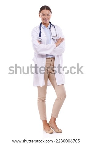 Confident in her career. Portrait of a beautiful doctor standing with arms folded against a white background. Royalty-Free Stock Photo #2230006705