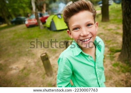 I love the camping in the great outdoors. Portrait of a young boy on a camping trip. Royalty-Free Stock Photo #2230007763