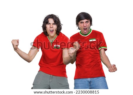 Two Soccer fans man with jersey and face painted with the flag of the Wales and IR IRAN teams screaming with emotion on white background. Royalty-Free Stock Photo #2230008815