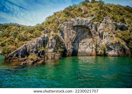 traditional rock carving lake taupo north island new zealand. High quality photo Royalty-Free Stock Photo #2230021707