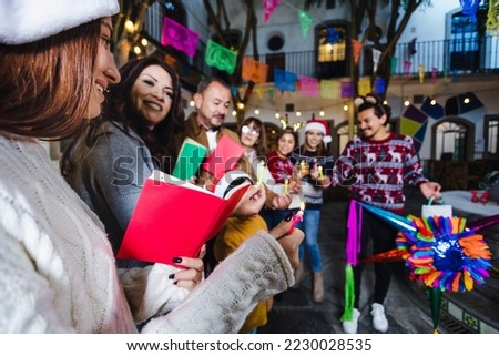 Posada, Mexican family Singing carols in Christmas party in Mexico Latin people