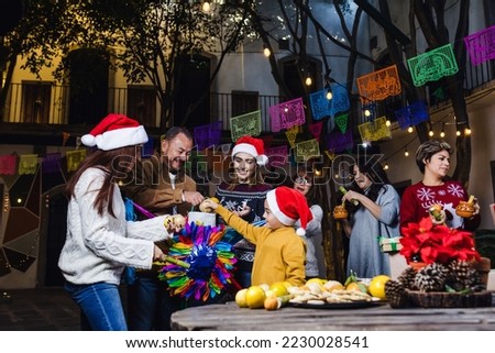 Posada, Mexican family Singing carols in Christmas party in Mexico Latin people Royalty-Free Stock Photo #2230028541