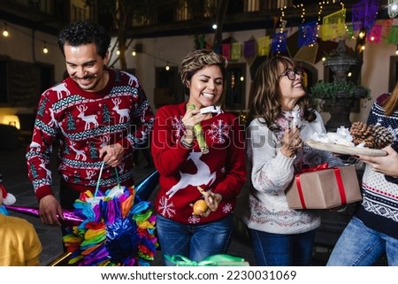 Posada, Mexican family Singing carols in Christmas party in Mexico Latin people