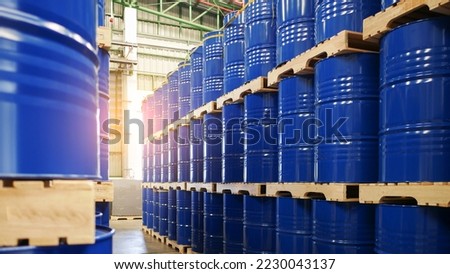 Blue barrel drum on the pallets contain liquid chemical in warehouse prepare for delivery to customer by made to order. Manufacture of chemicals production. Oil and chemical industrial works concept Royalty-Free Stock Photo #2230043137