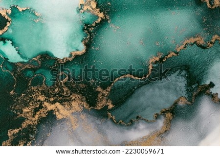 Marble ink abstract art from exquisite original painting for abstract background . Painting was painted on high quality paper texture to create smooth marble background pattern of ombre alcohol ink . Royalty-Free Stock Photo #2230059671
