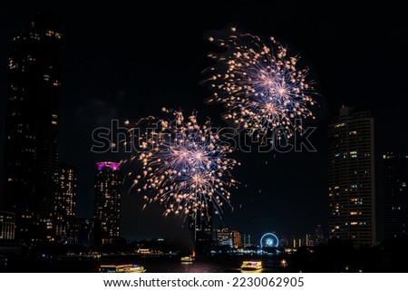 fireworks celebration on the river in the dark sky