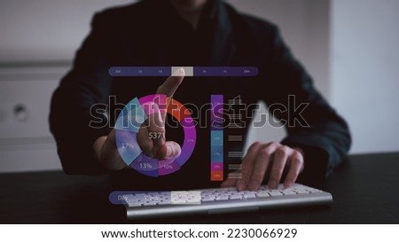 Analyst working with Business Analytics and Data Management System on computer, make a report with KPI and metrics connected to database. Corporate strategy for finance, operations, sales, marketing. Royalty-Free Stock Photo #2230066929