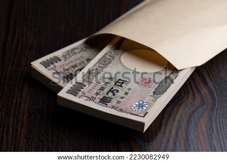 Japanese one million yen bills on the table. Royalty-Free Stock Photo #2230082949