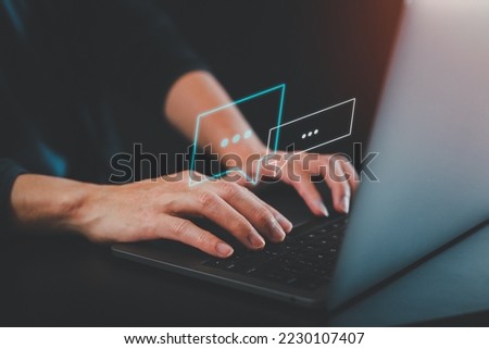 Man using a social media marketing concept on Laptop with notification icons of message, comment, chat, email. and shopping cart Laptop computer hologram screen.