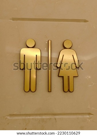 Toilet sign of both man and woman