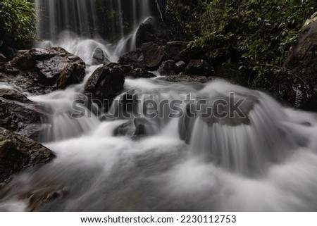 Part of Pha Takien Waterfall in deep forest in Sakaew Province, Thailand. Long explosed image.
