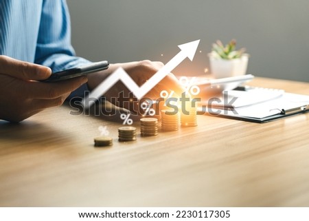 interest rate and dividend concept, Businessman is calculating income and return on investment in percentage. income, return, retirement, compensation fund, investment, dividend tax, stock market Royalty-Free Stock Photo #2230117305