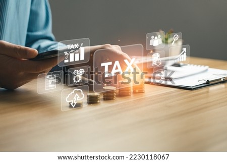 Tax payment and tax deduction planning involve strategies to minimize tax liability. This includes maximizing deductions and credits, deferring income, and accelerating deductions. tax professional Royalty-Free Stock Photo #2230118067