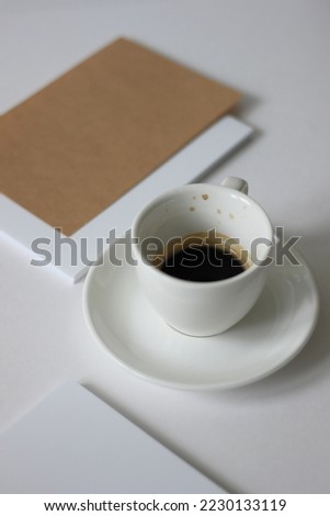 Cup of Espresso on White Office Desk with Blank White Cards. Coffee Break. Business Meeting.