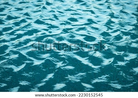 Light Blue swimming pool rippled water texture reflection