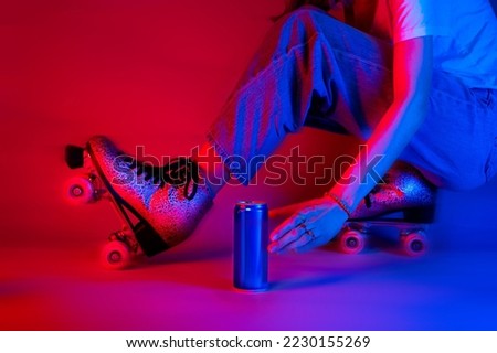 Roller skater reaching for a soda drink in a can while skating. Sports and recreation - saturated red and blue, pop art style poster. Royalty-Free Stock Photo #2230155269