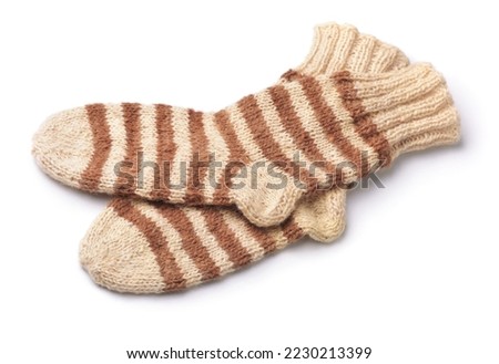 Pair of striped woolen knitted socks isolated on white Royalty-Free Stock Photo #2230213399