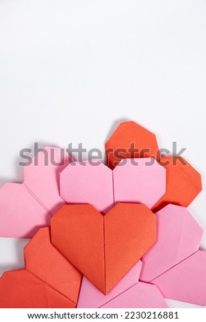 Origami for Valentine's Day - hearts made of paper on a white background do it yourself
