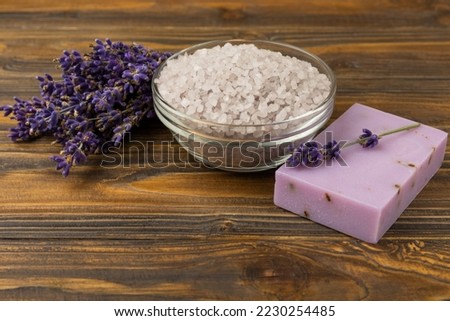 Lavender flowers, fragrant sea salt and handmade soap. The concept of spa, beauty and health salon, skin care cosmetics. Natural cosmetics.Aroma procedures. Close up photo on white wooden background.