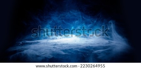 Earth in cracks on dark background. Panoramic view of the abstract fog.  Beautiful swirling blue smoke. Mockup for your logo. Wide angle horizontal wallpaper or web banner.