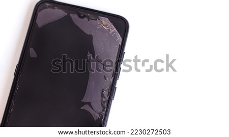 Broken screen of a mobile cellular smartphone fragment, repair and service replacement of the phone display, selective focus, copy space for text