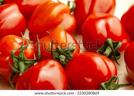 Background from tomatoes, close-up. Red tomatoes for publication, poster, screensaver, wallpaper, banner, cover, post. Low in calories and containing much vitamin C. Healthy diet. High quality photo