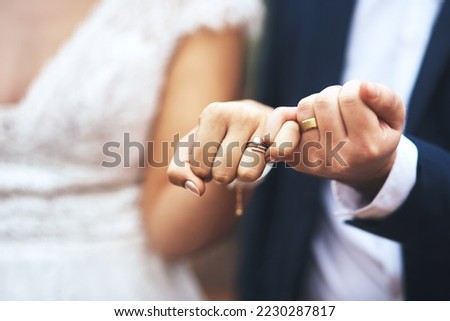 I pinky promise Ill be by your side forever. Cropped shot of an unrecognizable newlywed couple doing a pinky swear gesture on their wedding day. Royalty-Free Stock Photo #2230287817