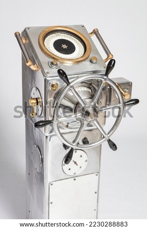 Cruise ship wheel. Close-up steering wheel of the boat. Sea navigation system. Rest and travel on a powerboat. steering wheel on old battleship. Using a fleet of military ships steering wheel Royalty-Free Stock Photo #2230288883