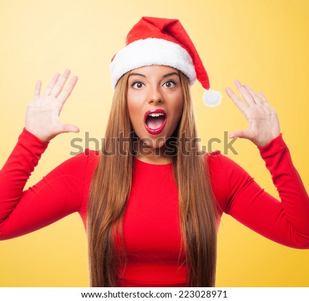portrait of a beautiful young woman with surprised gesture at Christmas