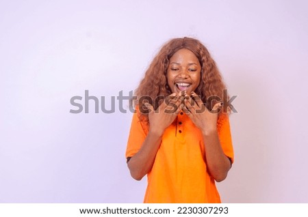 Happy winner! Young African American black woman isolated on white background