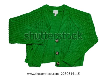 Casual elegant fluffy long-sleeved cardigan with V-neck and button closure isolated on a white background. Clipping path. Womens green sweater or jumper. Autumn and winter fashion. Royalty-Free Stock Photo #2230314115