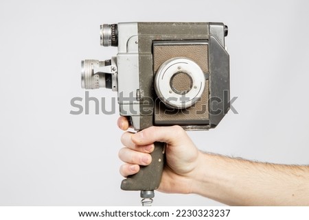 Old 8mm Movie Camera isolated on white. Vintage old video camera isolated on white