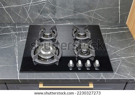 Gas Only Black Cooktop Stove at Marble Kitchen Counter Royalty-Free Stock Photo #2230327273