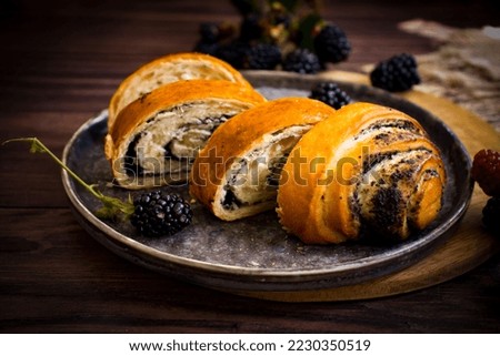 Poppy seed roll on old background