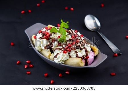 Banana Split with Ice Cream on Top Royalty-Free Stock Photo #2230363785
