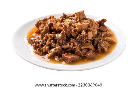 Wet cat food on a white plate cutout. Feeding plate full of meat and liver pieces in a sauce for cats isolated on a white background. Canned meat for domestic pet animals concept. Front view. Royalty-Free Stock Photo #2230369049