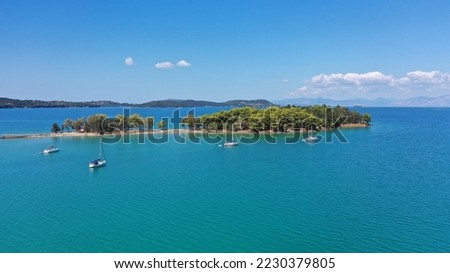 Aerial drone photo of small islet of Koukoumitsa in picturesque seaside village of Vonitsa, Western Greece Royalty-Free Stock Photo #2230379805