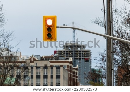 Traffic lights in street with buildings and construction site in downtown district of Ottawa, Canada