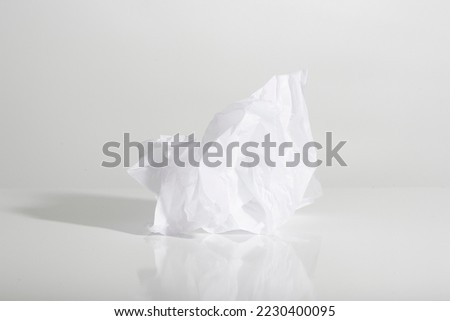 crumpled piece of paper against a harsh light