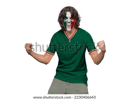 Soccer fan man with jersey and face painted with the flag of the Mexico team screaming with emotion on white background.