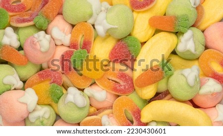 Mix of jelly colorful candys and marshmallows as a background. 