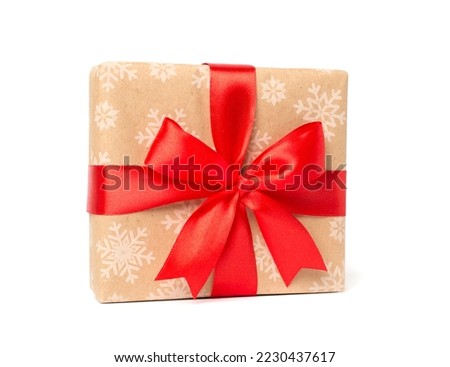 Gift box with red ribbon bow isolated on white