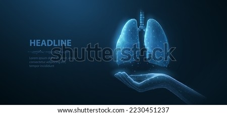 Lung health. Abstract 3d lung on hand. Lung care, tuberculosis awareness, world cancer day, pneumonia patient, organ anatomy, pulmonary medicine, corona virus, lung donor concept. Isolated on blue. Royalty-Free Stock Photo #2230451237
