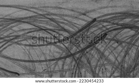 Aerial view tire track mark on asphalt tarmac road race track texture and background, Abstract background black tire track skid on asphalt road, Tire mark skid mark on asphalt road. Royalty-Free Stock Photo #2230454233