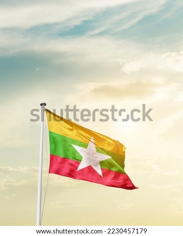 Myanmar national flag waving in beautiful sky.