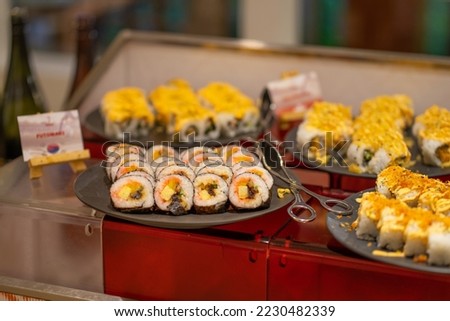 Assorted sushi roll on buffet table or buffet island.