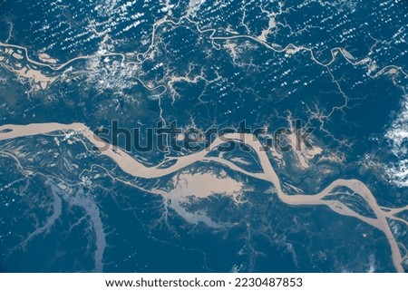 Aerial view of the Amazon River in Brazil. Digitally enhanced. Elements of this image furnished by NASA.